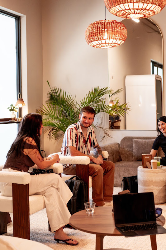 Members seated together in the CALMA lobby lounge